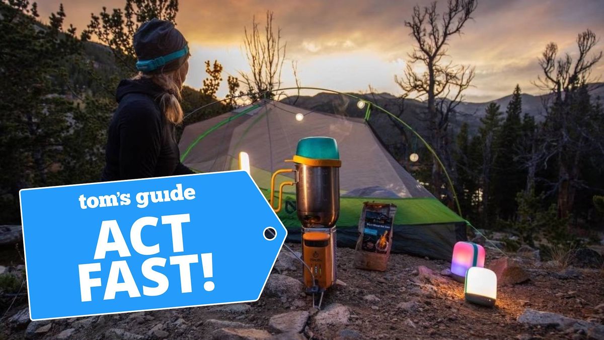 Woman camping during dusk 