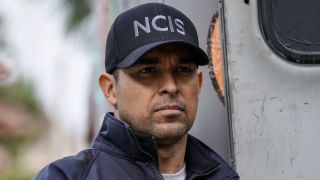 Wilmer Valderrama wearing NCIS hat and jacket