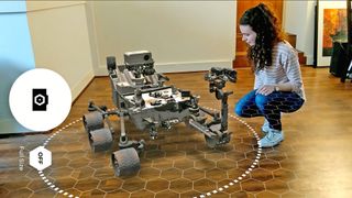 Augmented reality provides an immersive way to learn about space. In this photo, NASA's Mars Curiosity rover pays a virtual visit to someone's living room via the agency's free Spacecraft AR mobile app.