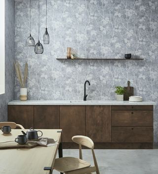dark wood kitchen with pale grey floral wallpaper