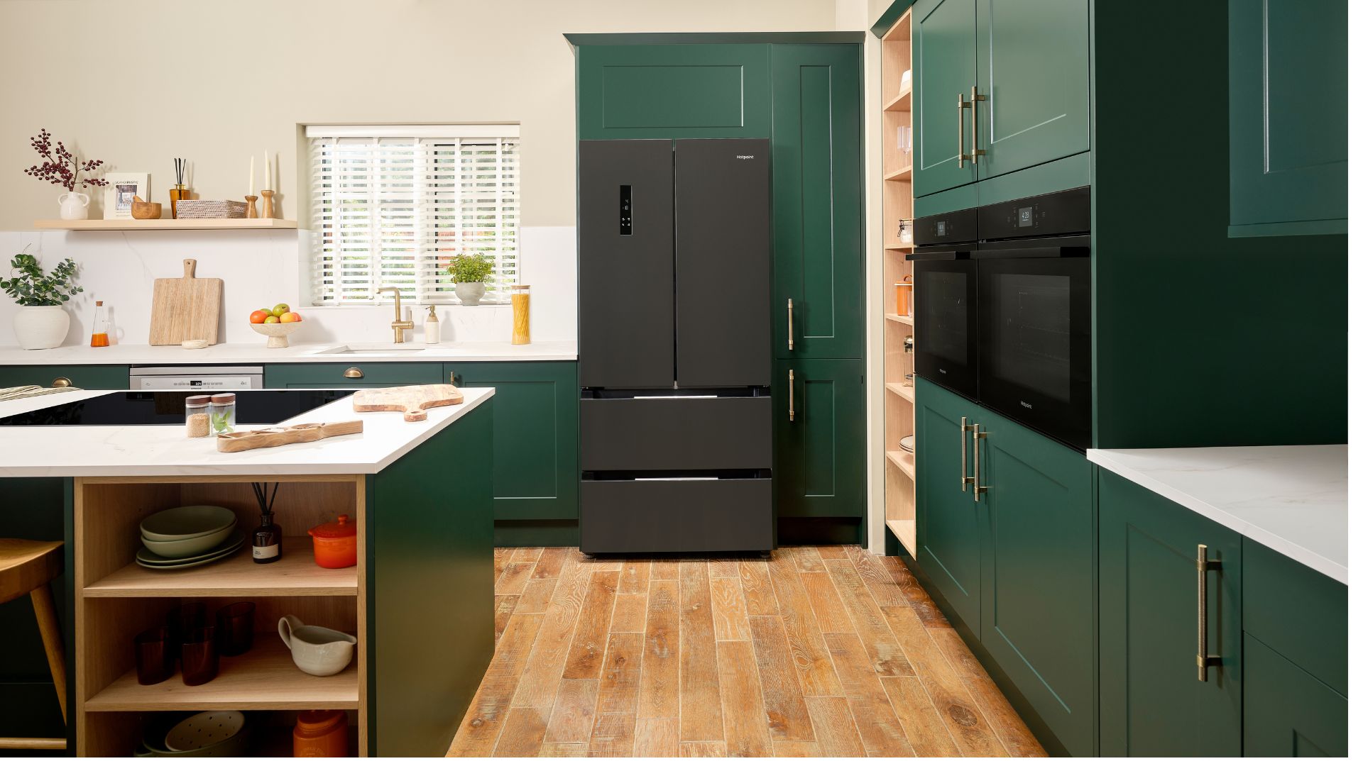 AO Hotpoint American Fridge Freezer in slate in a green kitchen with white walls