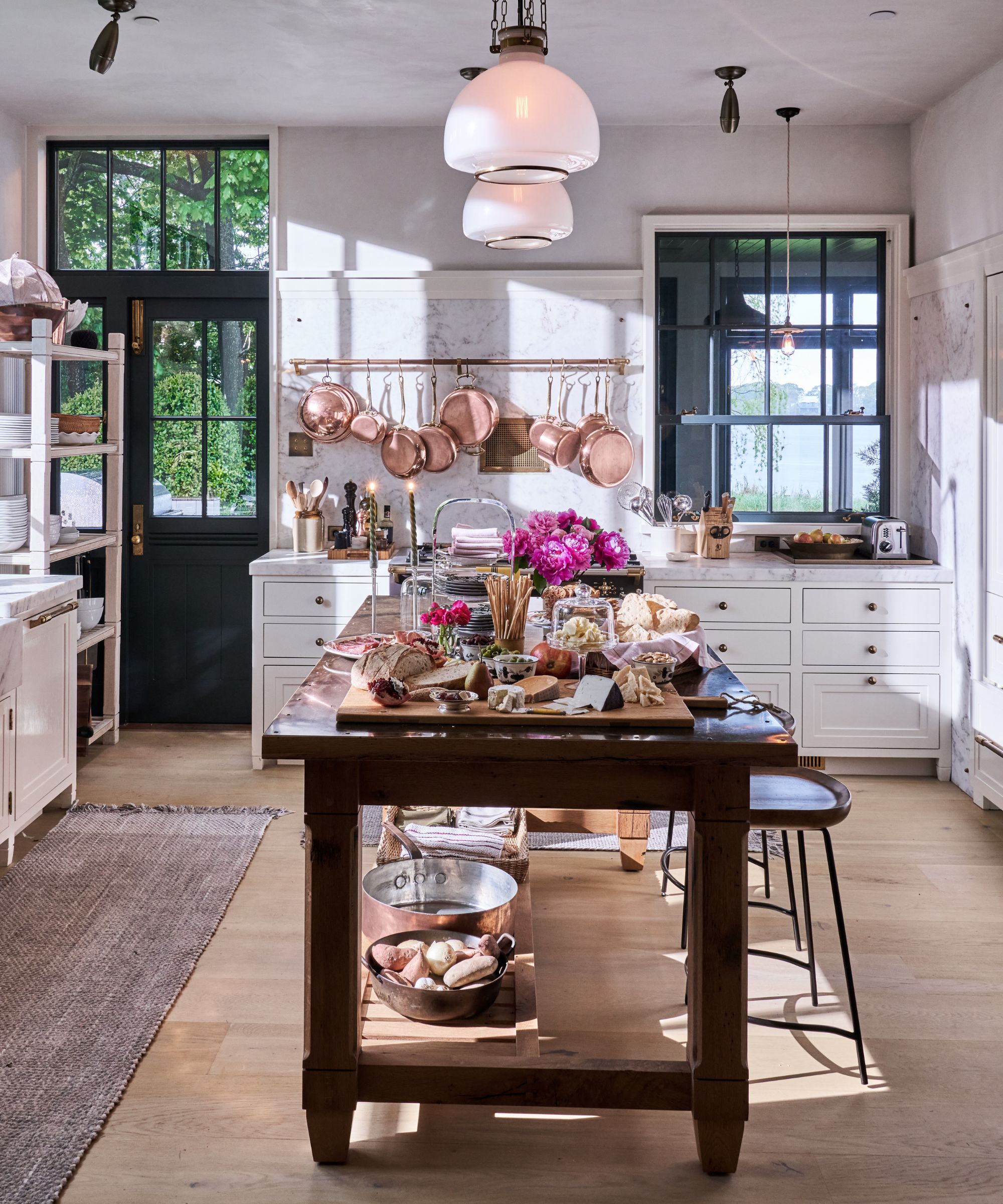 Bryan Graybill's kitchen with island in the middle and copper pans on display