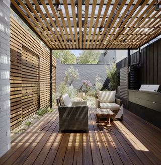 A backyard with overhead screen
