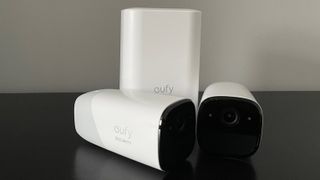 A number of EufyCam 2 Pro security cameras sitting on a desk