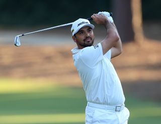 Jason Day strikes an iron shot from the fairway