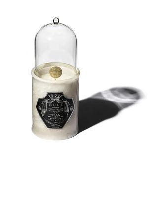 Officine Universelle Buly large candle in marble jar and glass cover.