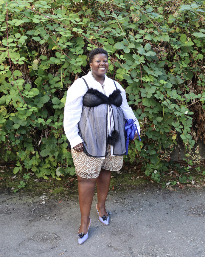 Lydia Okello wears a see through top over a white shirt and zebra shorts