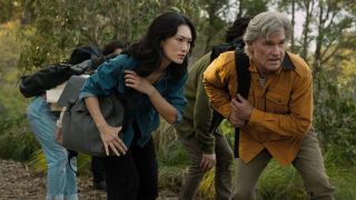 Keiko slightly crouched down next to Lee Shaw in Monarch: Legacy of Monsters Season 2