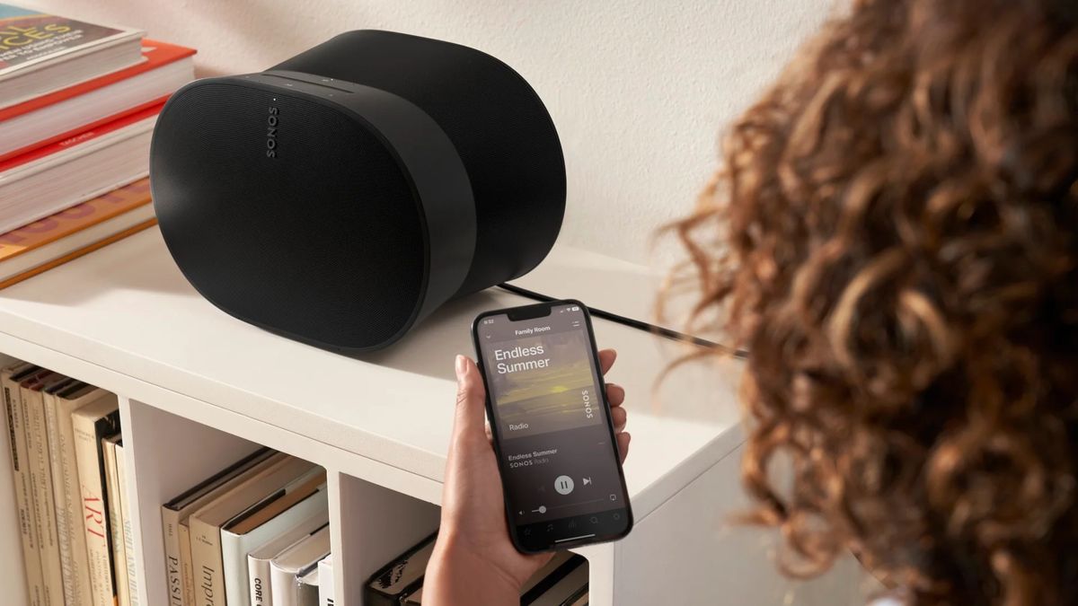 Sonos app in front of Sonos speaker 