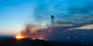 On Oct. 28, 2014, an Orbital ATK Antares rocket exploded shortly after liftoff from the Mid-Atlantic Regional Spaceport's Pad-0A at NASA's Wallops Flight Facility on Wallops Island, Virginia. NASA photographer Joel Kowsky captured this view of fire and smoke at the launchpad after the explosion.