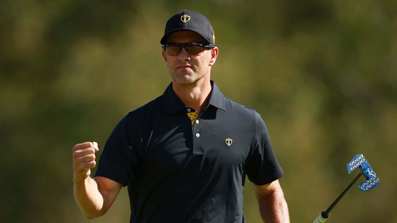 Adam Scott celebrates holing a putt in the Presidents Cup Friday foursomes