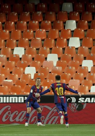 Barcelona’s Antoine Griezmann celebrates his goal with Lionel Messi