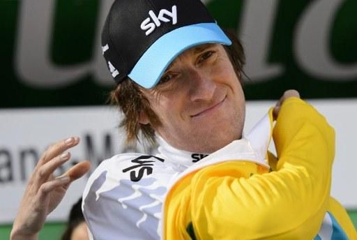 Wiggins puts on the yellow jersey after the final stage at the 2012 Tour de Romandie