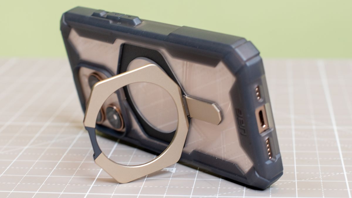 Urban Armor Gear Plasma XTE from back showing kickstand holding up iPhone 16 Pro desert titanium