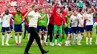 Gareth Southgate celebrates with the England team after qualifying for the Euro 2024 semi-finals in Germany