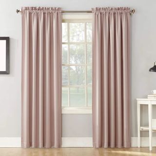 Wayfair Basics Thermal Curtain Panel against a gray wall.