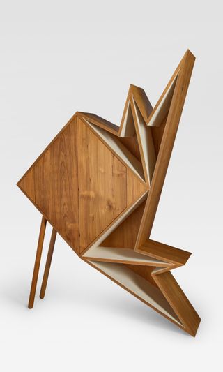 A wooden cabinet with spiky angular shelves by Aljoud Lootah