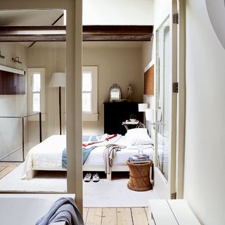bedroom with wooden flooring and bed