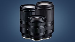 Three Tamron lenses on a blue background