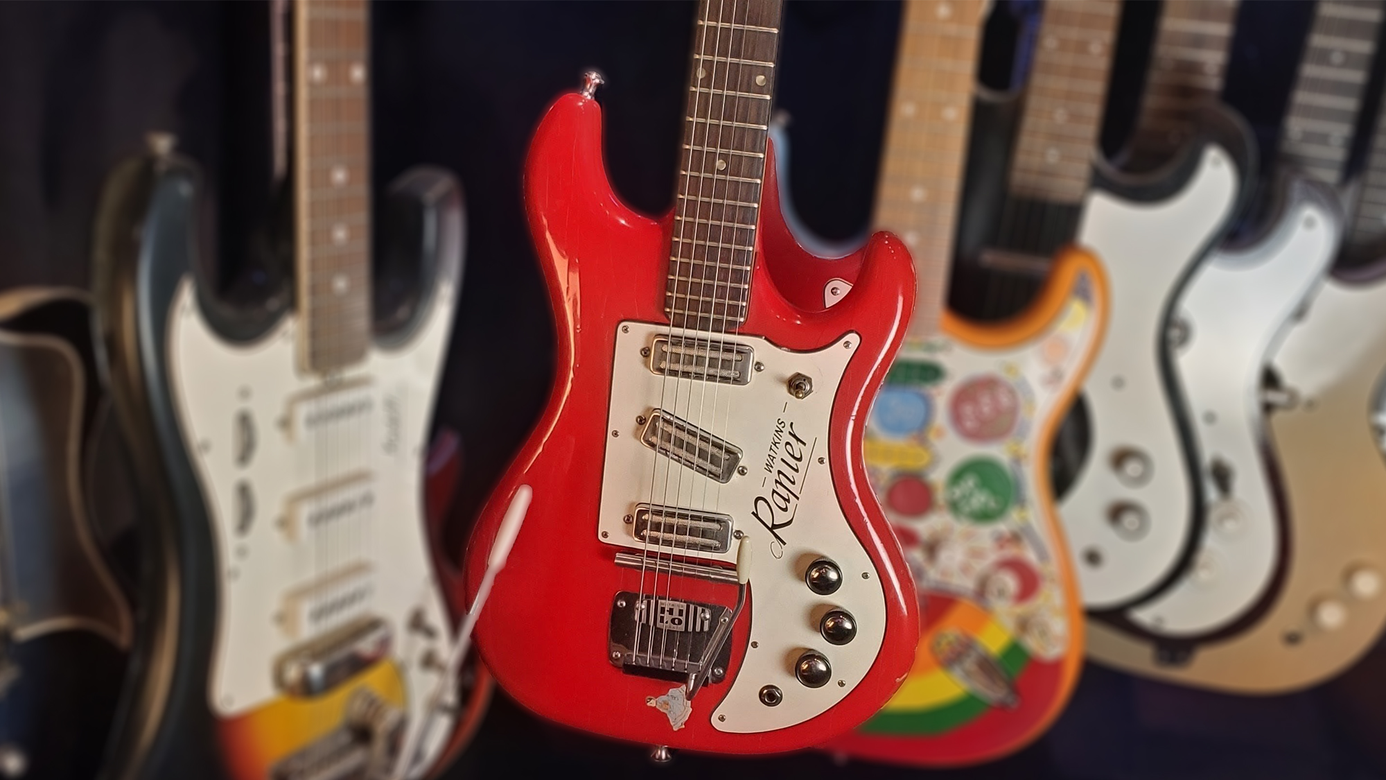 A photo of a Watkins Rapier 3 (center red) amid other guitars in the collection of Guitar Player contributing columnist Terry Carleton