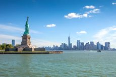 Liberty Island overlooking Manhattan Skyline on a bright summer day
