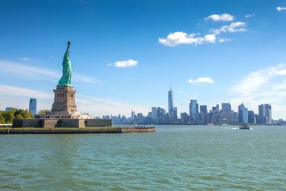 Liberty Island overlooking Manhattan Skyline on a bright summer day
