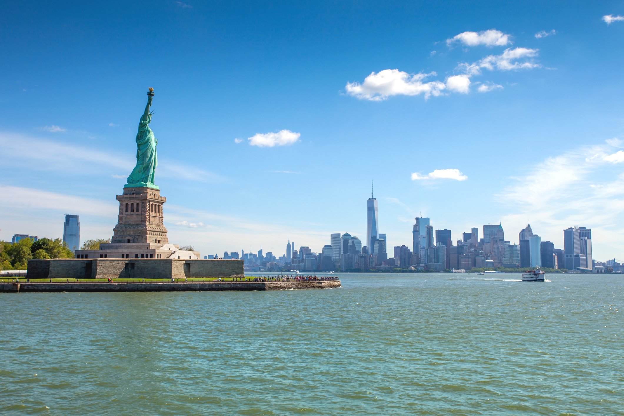 Liberty Island overlooking Manhattan Skyline on a bright summer day