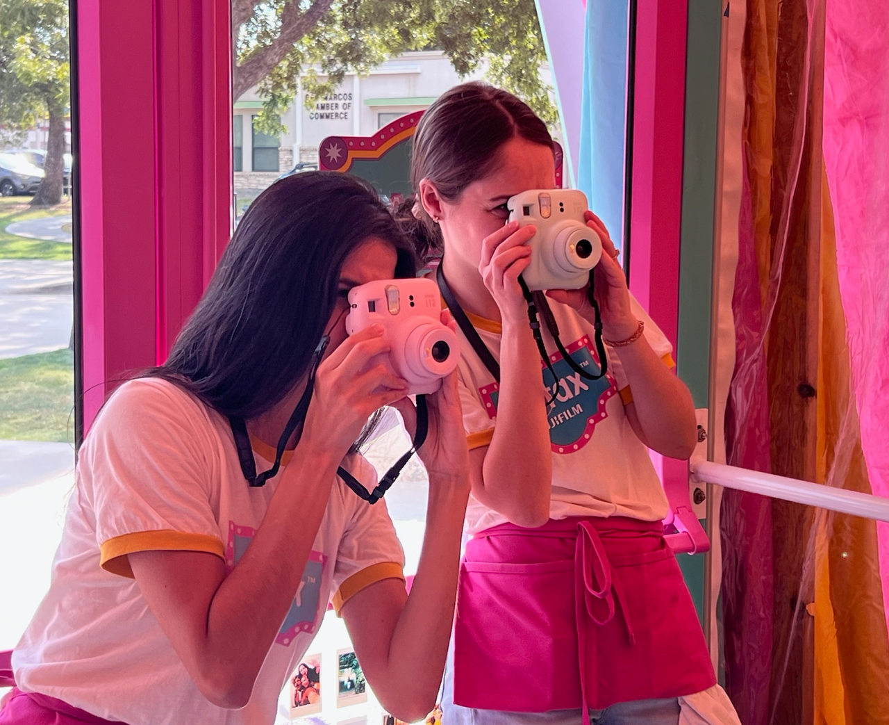 Guests try out Instax cameras at an event