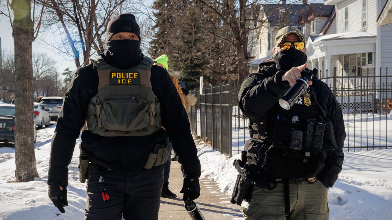 ICE agents point at observers in Minneapolis