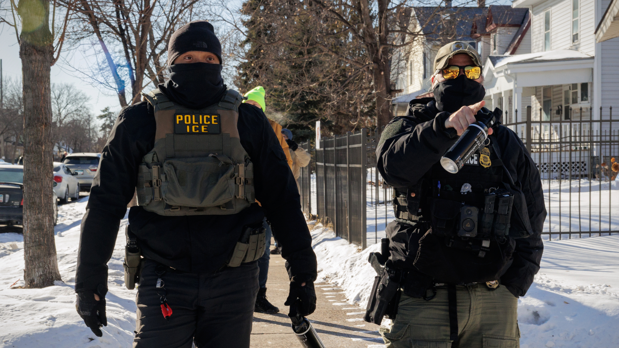 ICE agents point at observers in Minneapolis