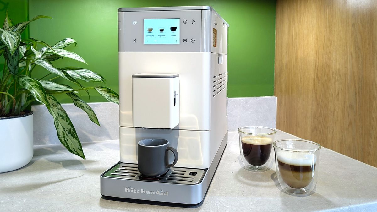 KitchenAid KF4 espresso machine with coffee drinks on kitchen counter