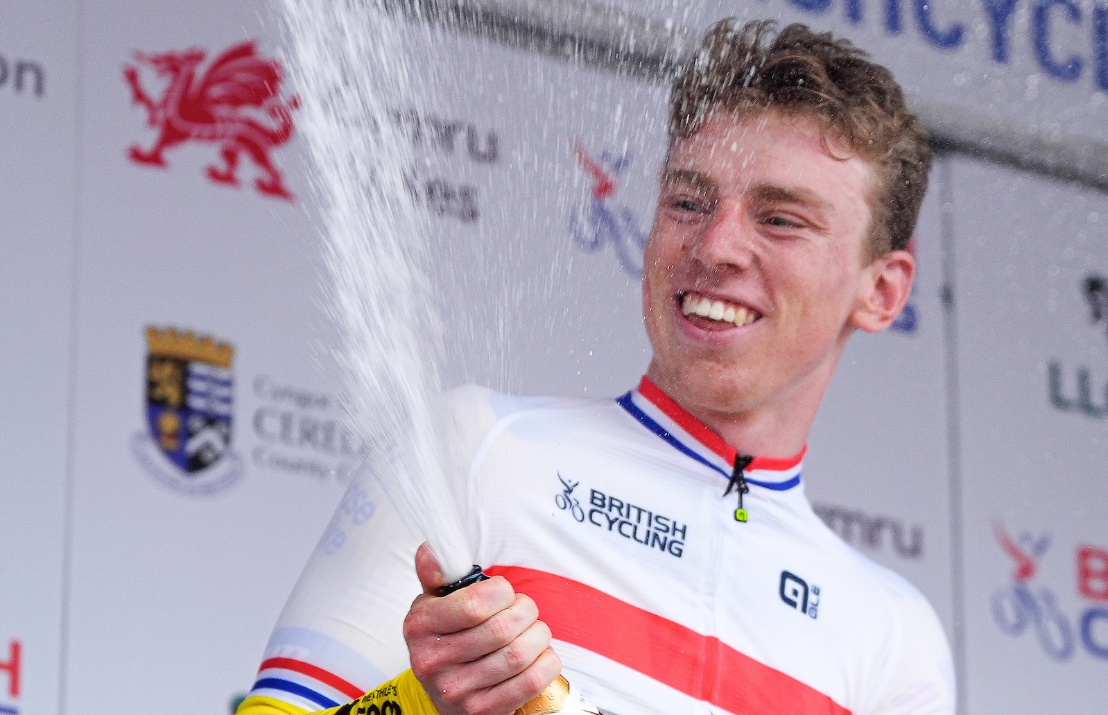 Picture by Olly Hassell/SWpix.com - 29/06/2025 - Cycling - 2025 Lloyds National Road Race Championships - Aberystwyth, Ceredigion, Wales - Open U23 Podium - Matthew Brennan (Team Visma - Lease a Bike) Wins the U23 Category to become National Champion