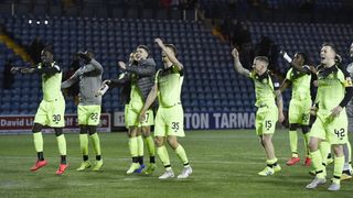 Celtic players celebrate their dramatic win