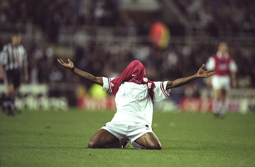 Ian Wright of Arsenal shows off the &#039;&#039;At Last&#039;&#039; written on his T-shirt after scoring the winning goal during an FA Carling Premiership match against Newcastle United at St James&#039;&#039; Park in Newcastle, England. Arsenal won the match 1-0. \ Mandatory Credit: Stu Forster/Allsport