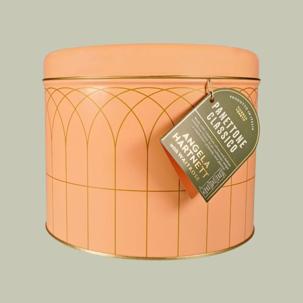 Angela Hartnett With Waitrose Panettone Classico in a salmon-tinted tin against a pale green background.