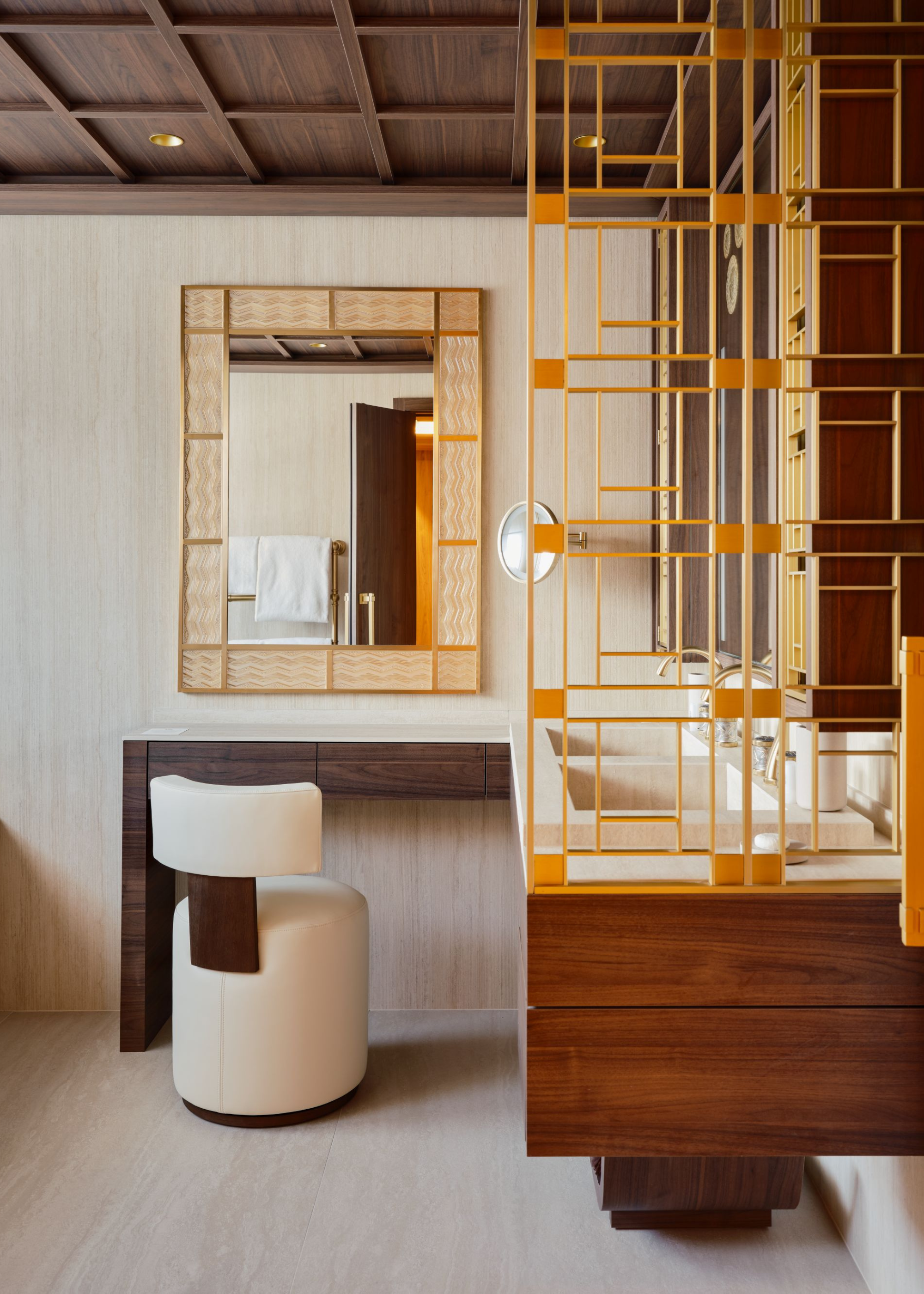 A bathroom and dressing area at the Maya Hotel Courchevel 1850 in a Japanese style with a divider by the bathroom sinks