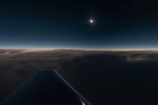 Chasing a Solar Eclipse: Wing of Dassault Falcon Jet 