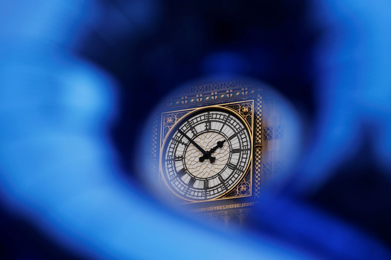 The Big Ben bell tower seen through a foil balloon.