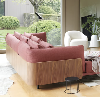 pink sectional sofa in a modern living room