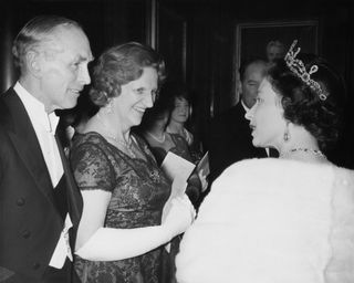 The Queen talks to Alec Douglas Home and his wife