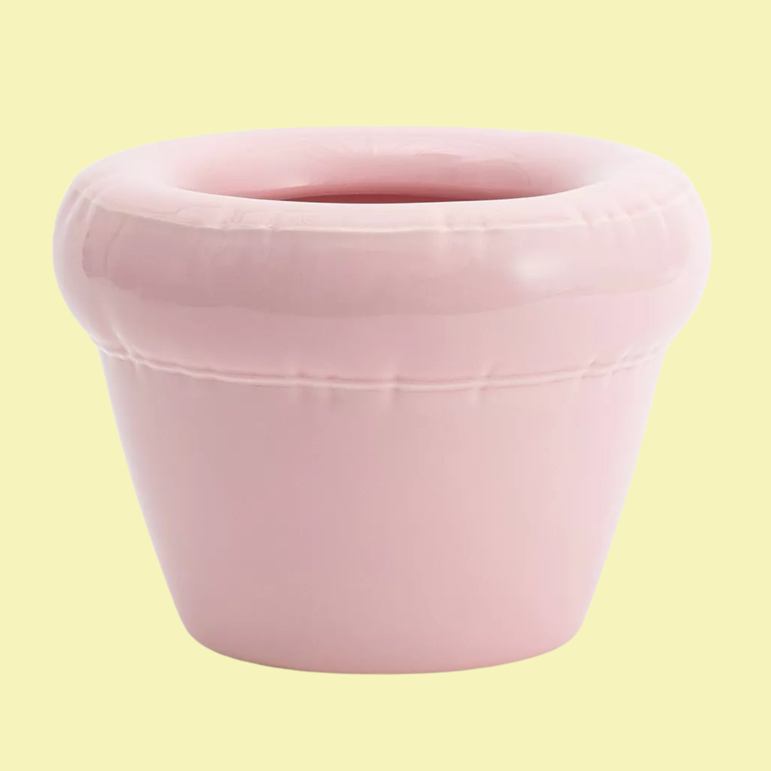 An inflated-style ceramic planter in a light bubblegum pink color