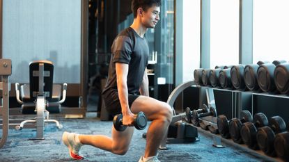 Man performing dumbbell reverse lunges