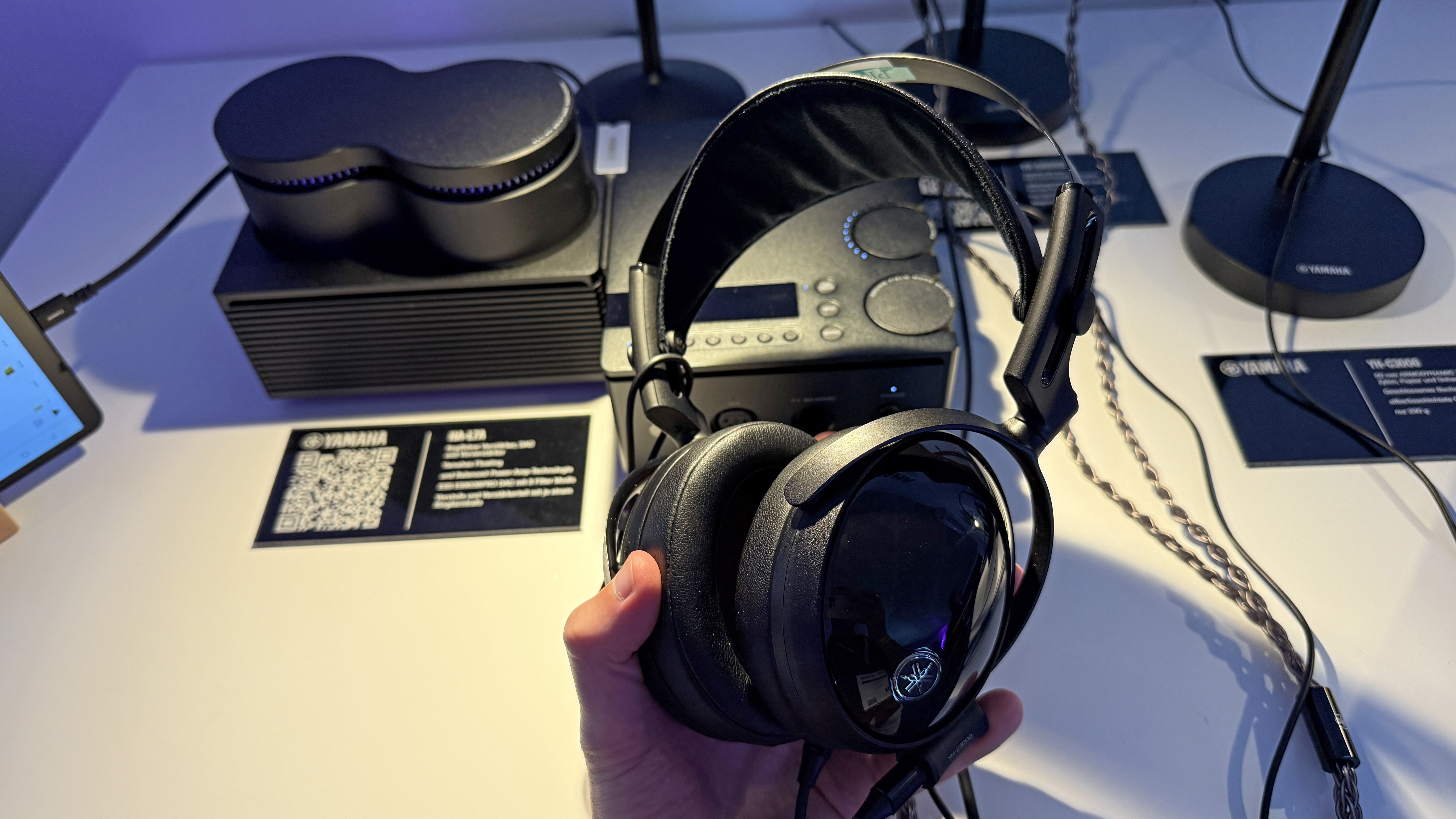 Yamaha YH-C300 in a man's hand at High End Munich 2025 show
