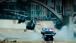 Helicopters chasing an ambulance in LA river in Ambulance movie