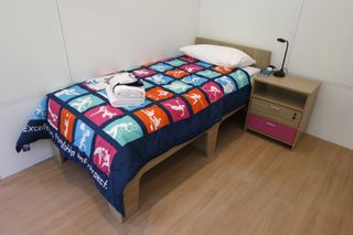 olympic village room and bed