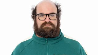 Contestant 100 looks at the camera