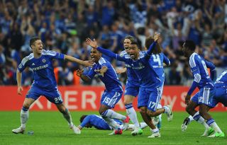 Chelsea players celebrate Didier Drogba's winning penalty against Bayern Munich in the shootout in the 2012 Champions League final.