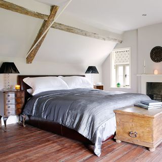 attic bedroom with wooden floor
