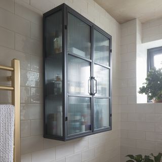 Bathroom with black fluted glass wall cabinet
