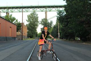 Image shows Anne-Marije Rook with her Brompton folding bike